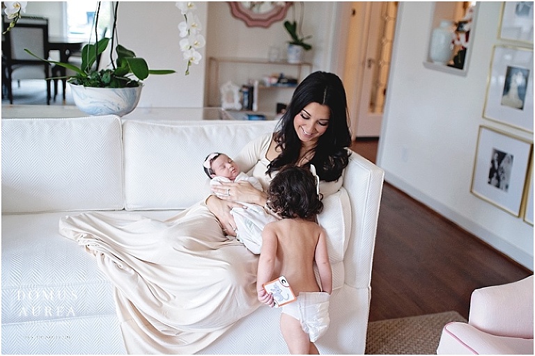 Sweet moments captured between mother and baby at a newborn session.