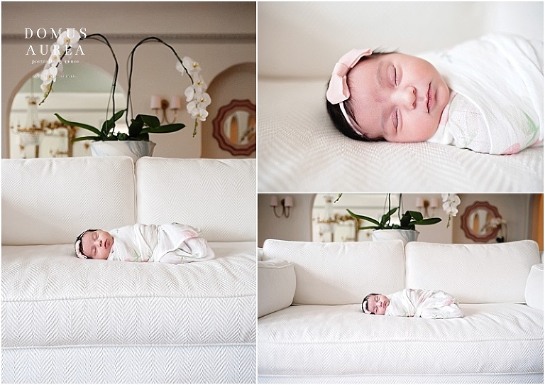 Baby laying on white couch at newborn session. 