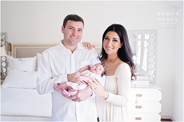 Sweet portrait of baby and her parents at newborn session.