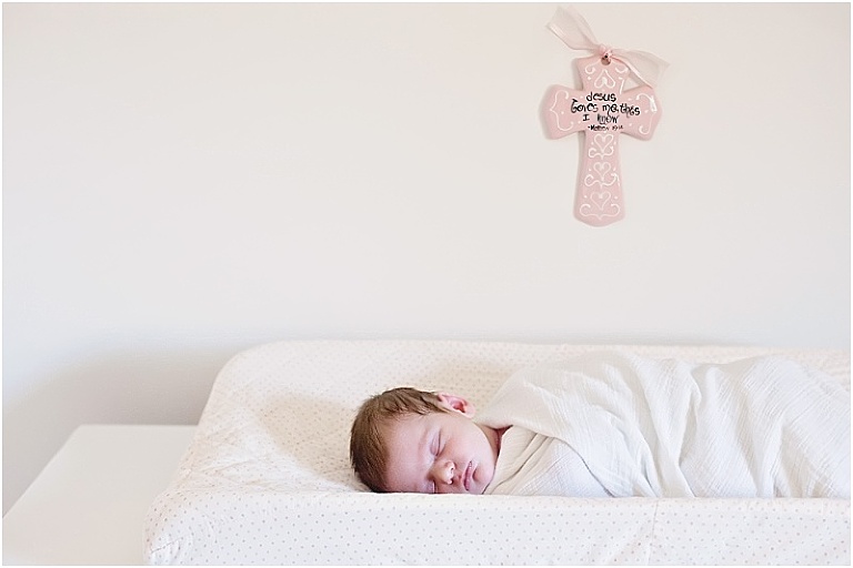 Baby sleeps on diaper changing pad