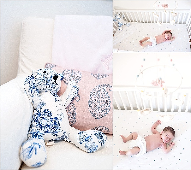 Baby girl lays in her nursery with mobile over her head