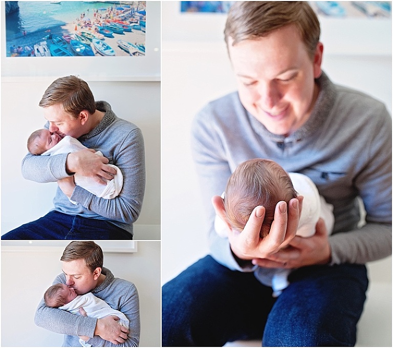 Baby looks tiny in daddy's hand