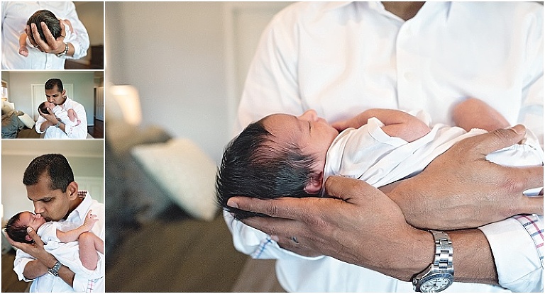 Newborn baby safe in daddy's arms.