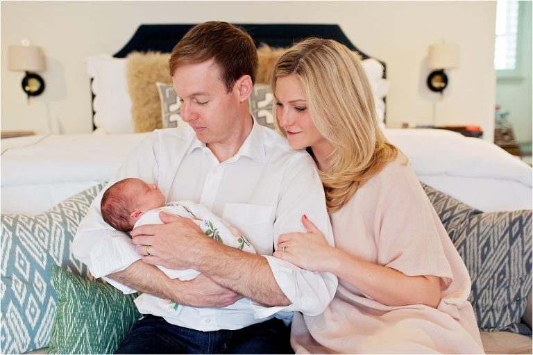 Houston newborn photographer photographs baby with parents
