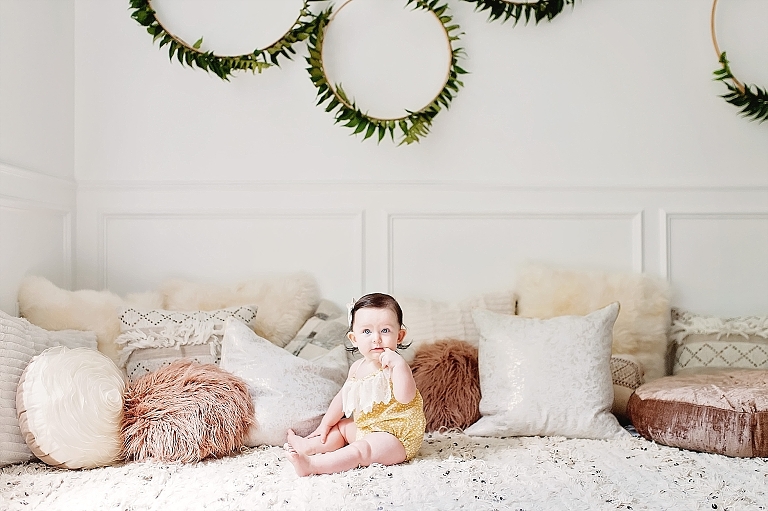 baby sits on floor