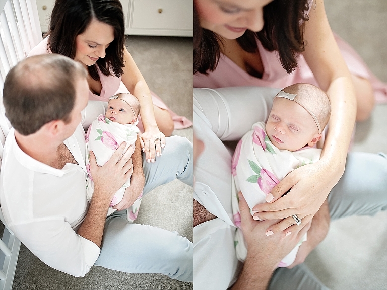 mommy and daddy hold newborn girl
