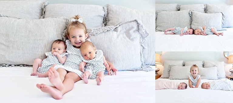 older sister holds her twin newborn sisters