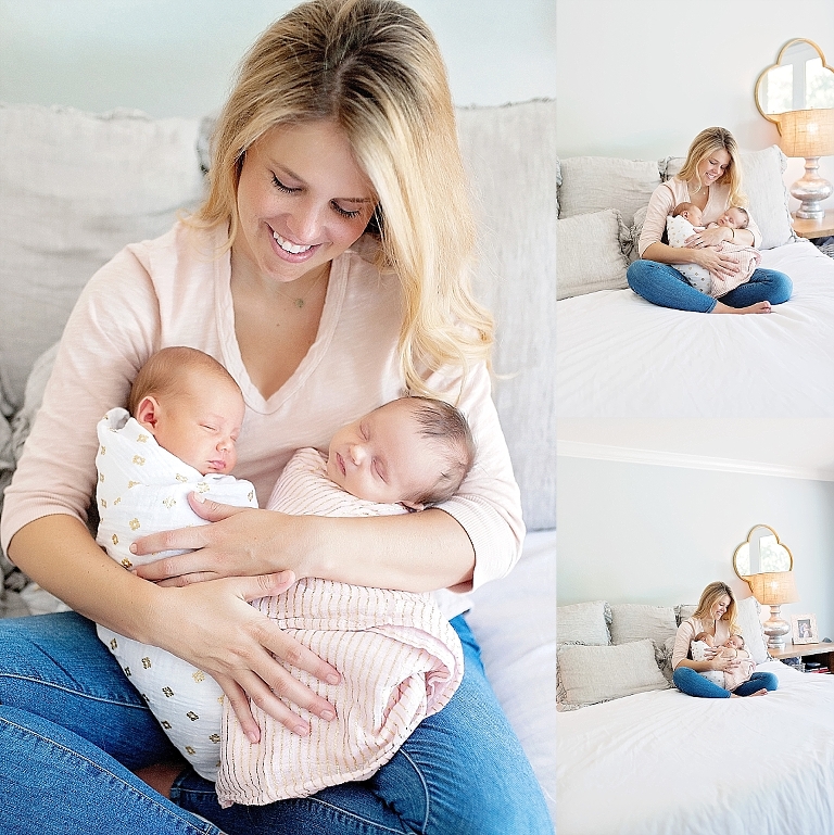 a mama holds her twin newborn daughters