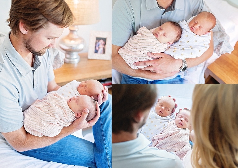 a daddy holds his twin daughters