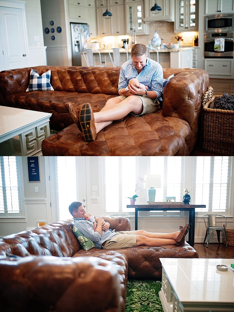 A dad holds his son on their couch