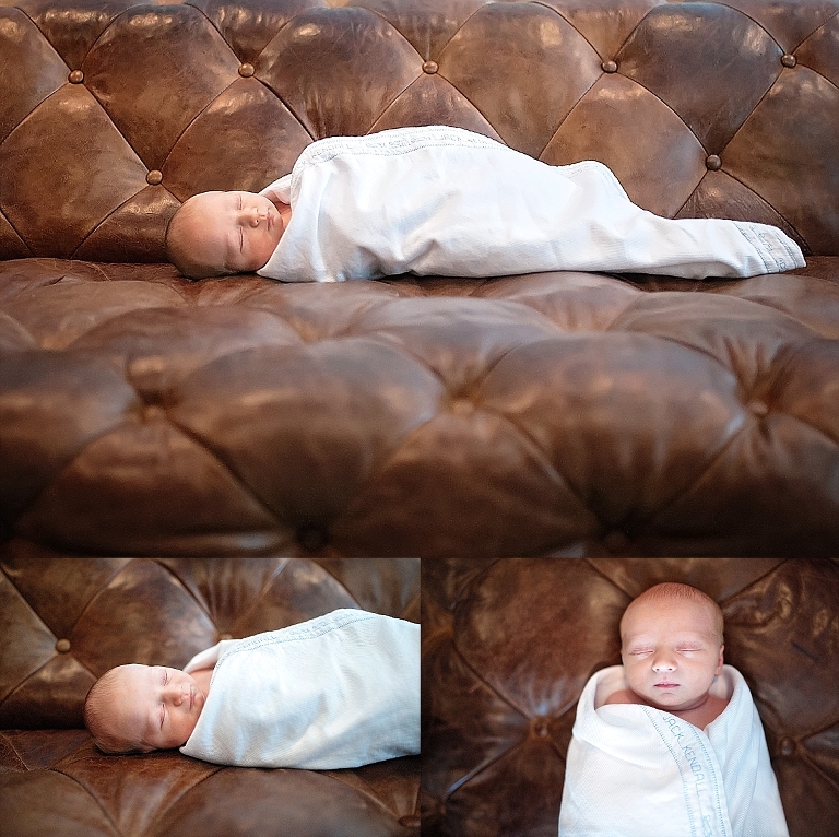 Baby boy lays swaddled on chesterfield sofa