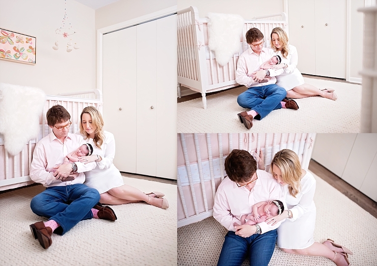 Mom and dad sit in nursery and hold their baby