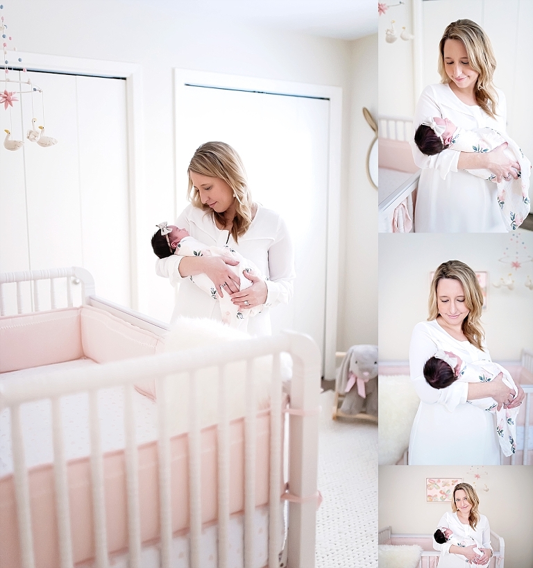 A mommy holds her newborn baby girl in the nursery