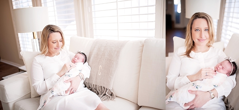Mom holds her daughter on the couch