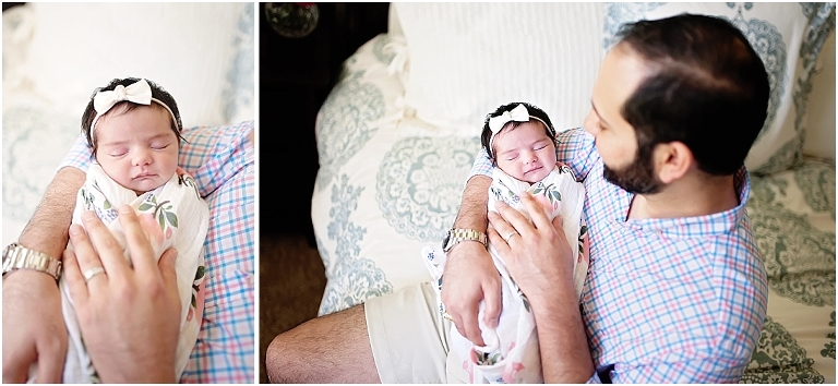 daddy holds his newborn daughter 
