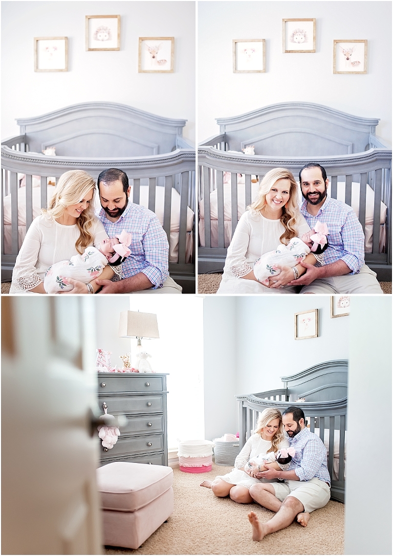 mom and dad smile for photo in their daughter's nursery