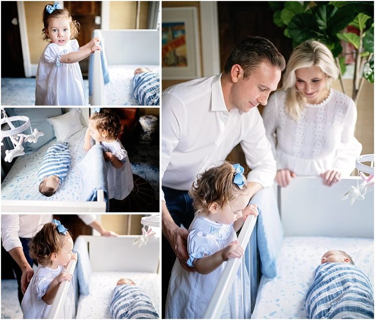 Everyone looks at newborn baby boy while he lays in his crib