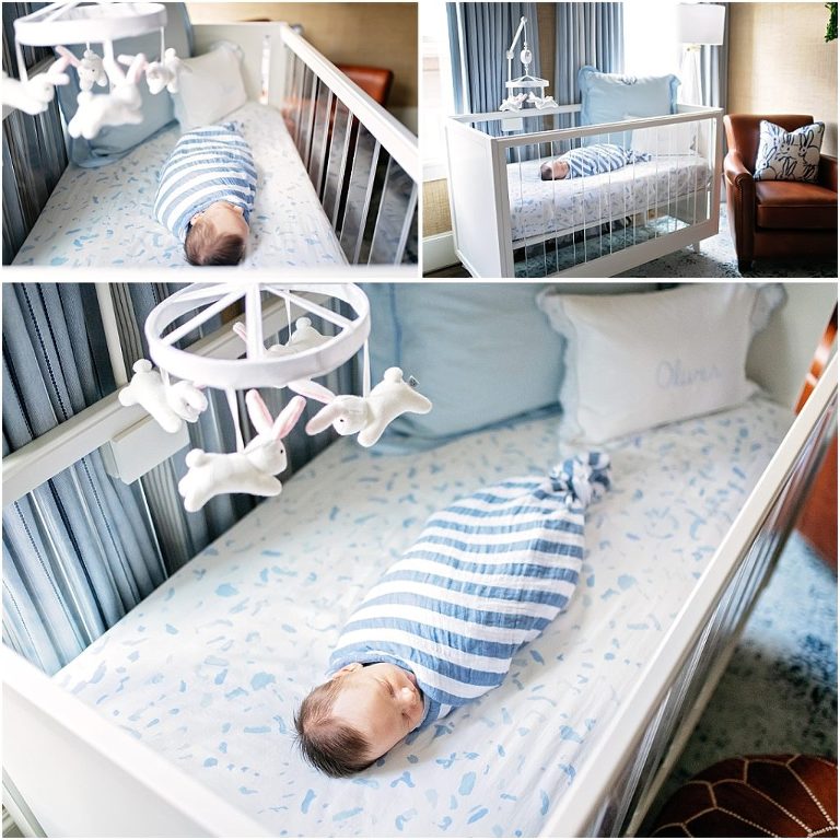 Baby boy sleeps swaddled in his acrylic crib