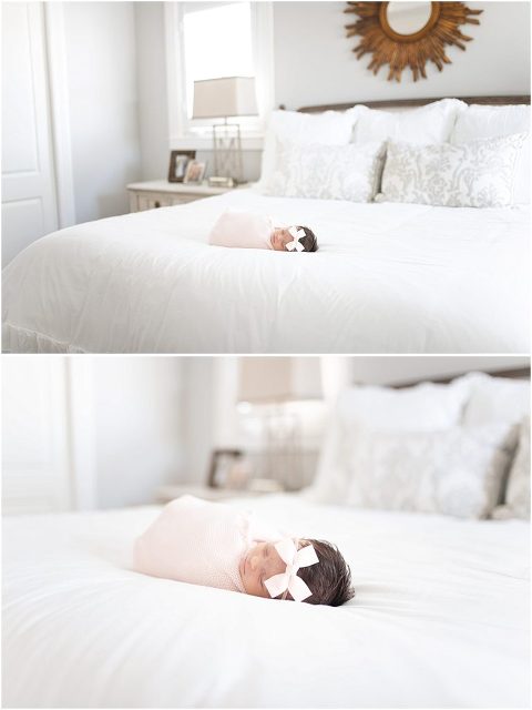 Baby lays sweetly on mom and dad's bed
