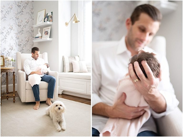 Daddy holds his daughter while rocking her