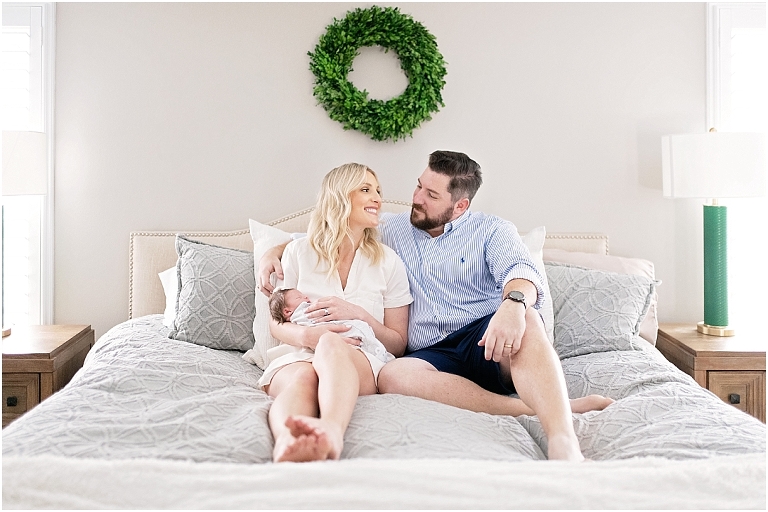 mom and dad look at one another during newborn session