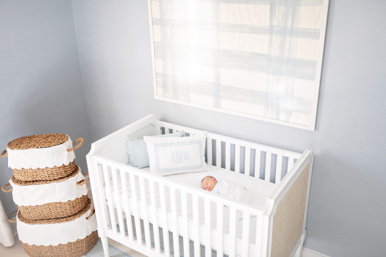 baby lays in serena and lily crib during newborn session