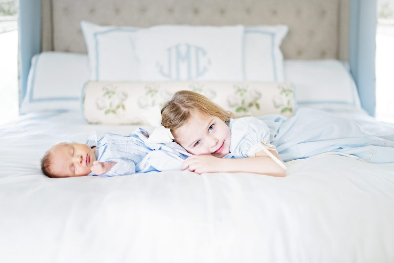 siblings snuggle wearing feltman brothers heirloom clothing