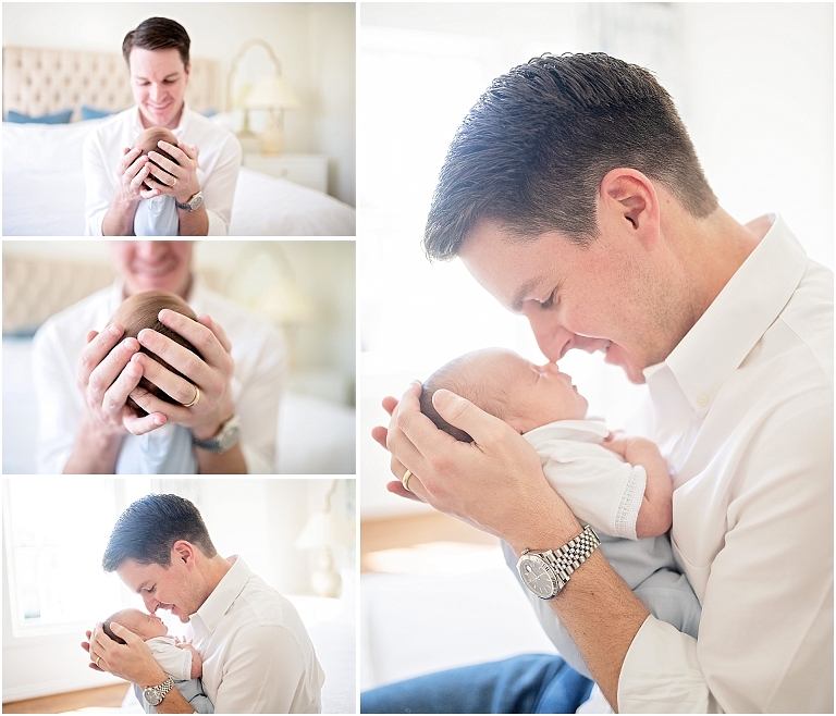 dad holds his newborn son