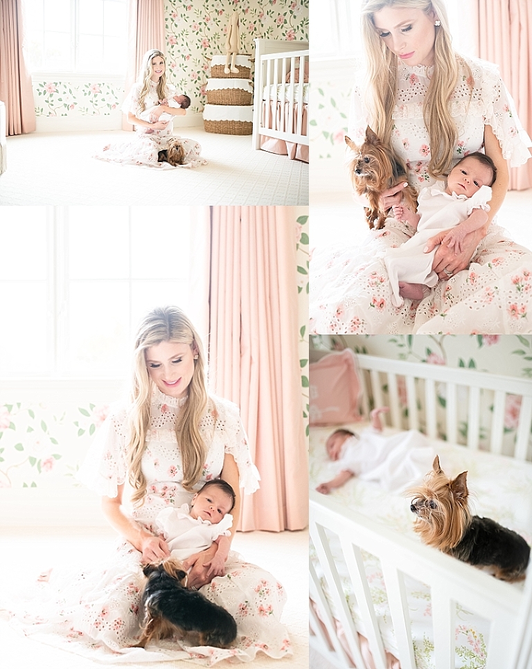 mom holds baby girl and her dog in nursery
