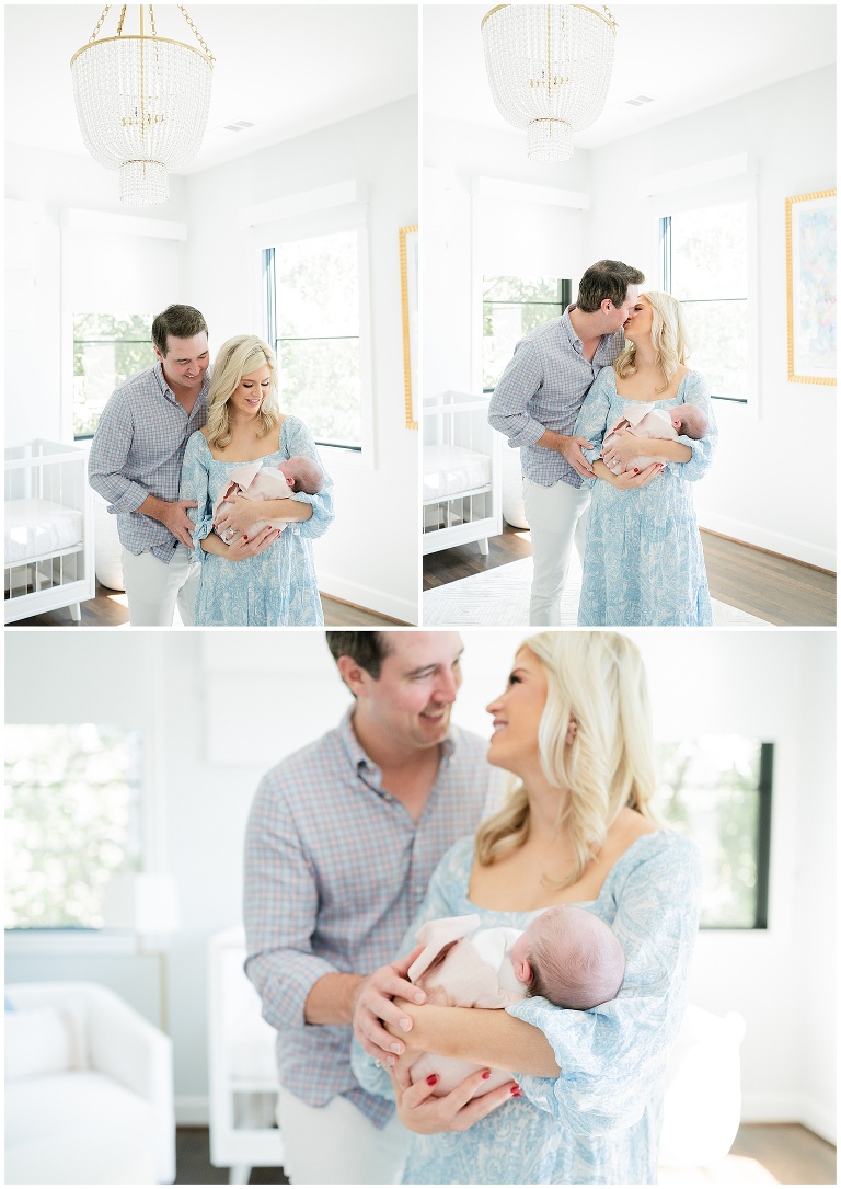 new parents hold their first baby